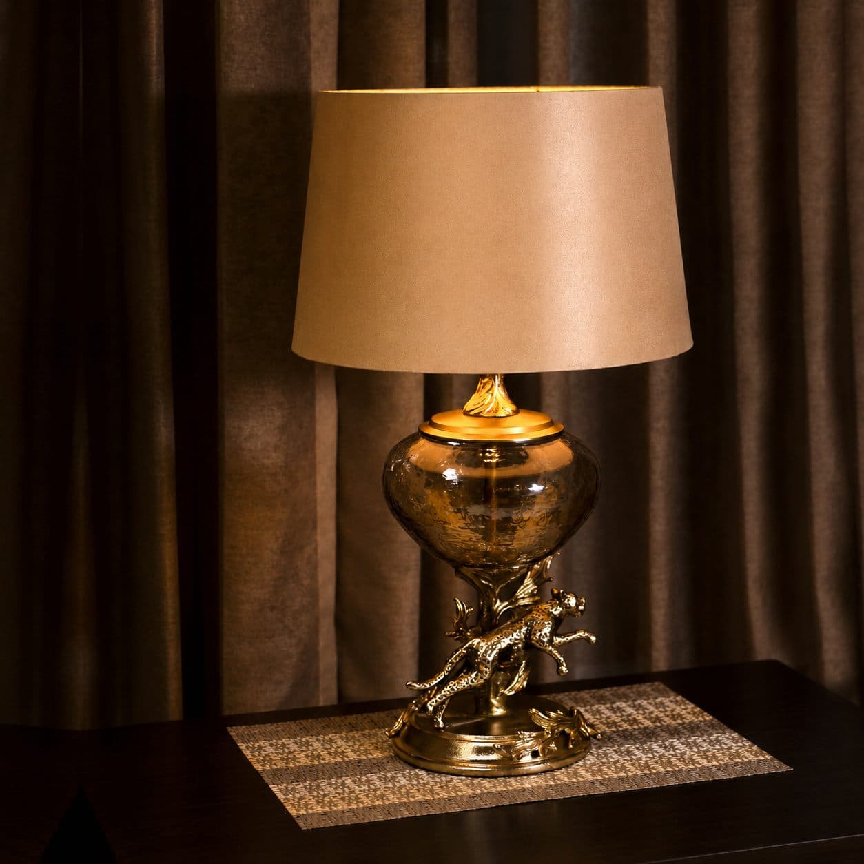 Shikar Cheetah Table Lamp — Cast brass & amber glass